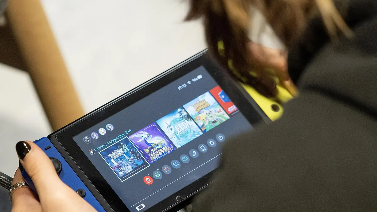 A handheld console being played